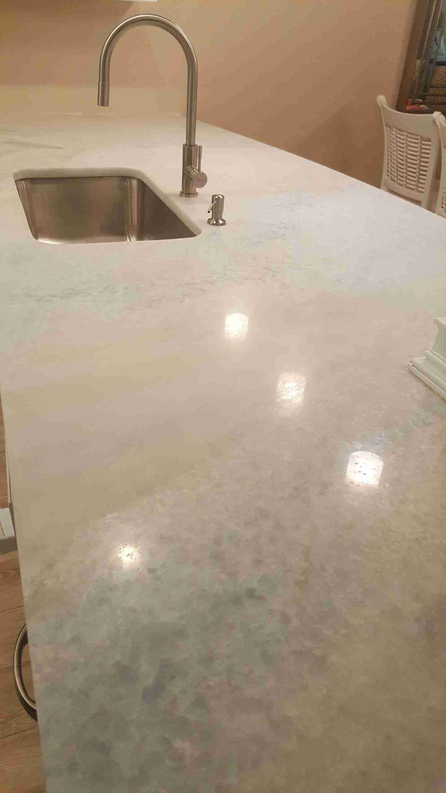 Photo of White and Gray Marble Countertops in a Residential Kitchen After Professional Marble Honing & Polishing by Bay Shore Cleaning & Restoration Bay Shore Cleaning & Restoration